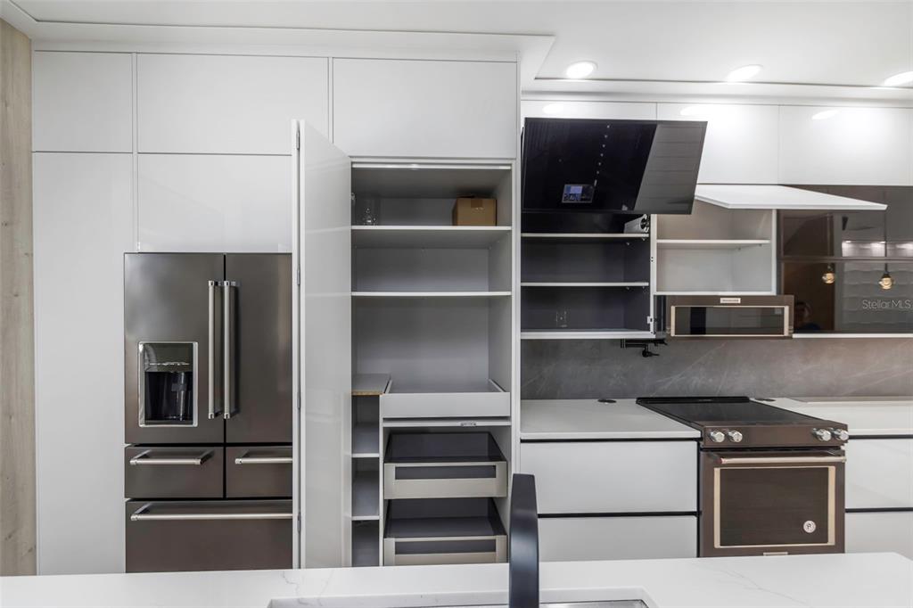 7130 102nd Lane Seminole, FL 33772 - Photo 6 of 31 a kitchen with a refrigerator and a stove top oven