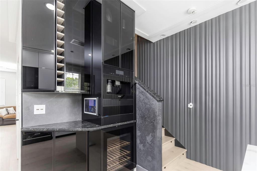 7130 102nd Lane Seminole, FL 33772 - Photo 8 of 31 a kitchen with stainless steel appliances kitchen island granite countertop a refrigerator a oven and a sink