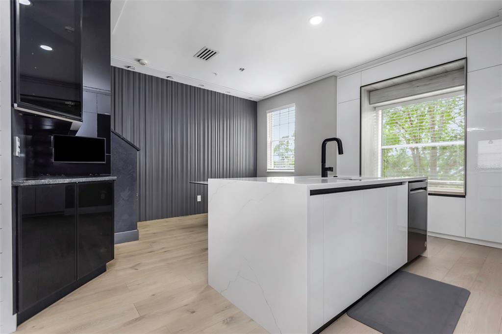 7130 102nd Lane Seminole, FL 33772 - Photo 9 of 31 a living room with a large window and stainless steel appliances