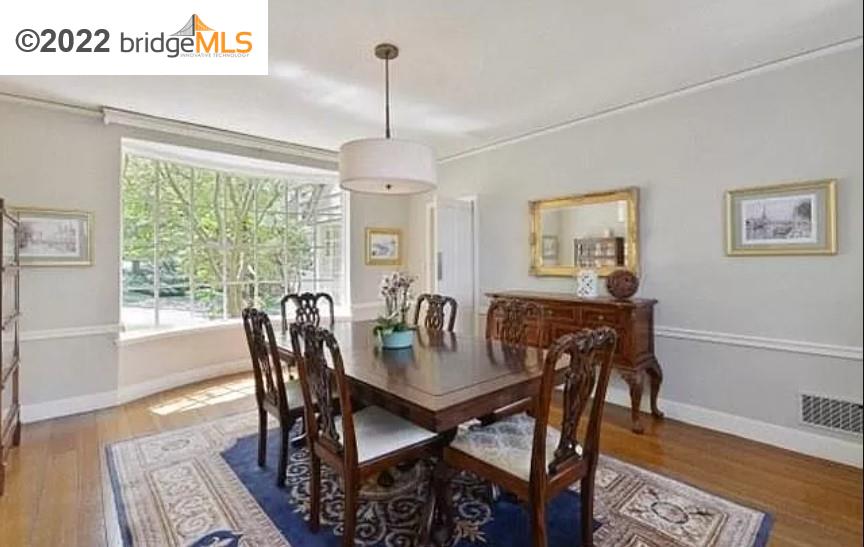 515 Hampton Road Piedmont, CA 94611 - Photo 4 of 13 a view of a dining room with furniture window and wooden floor