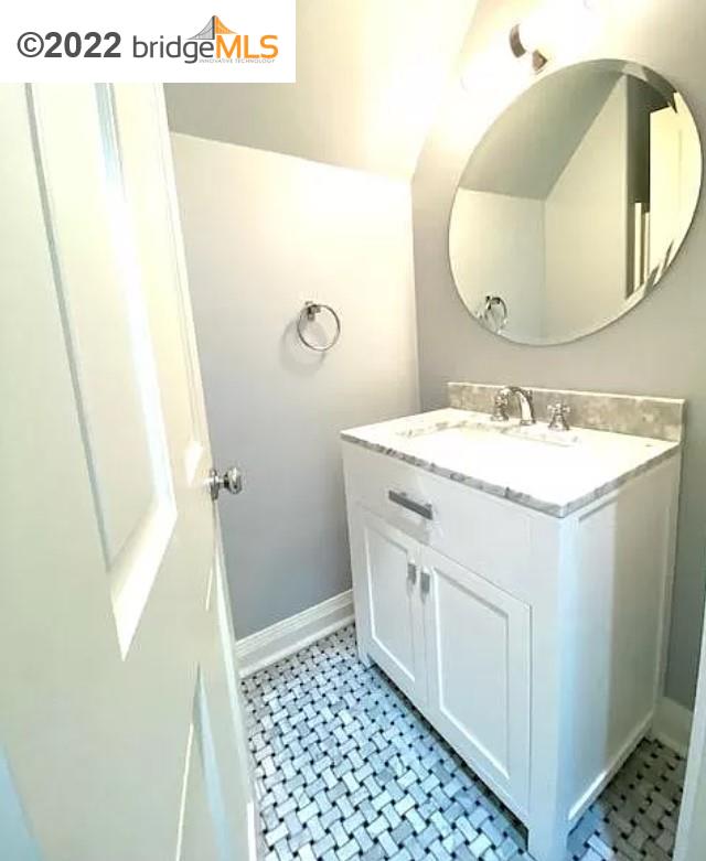 515 Hampton Road Piedmont, CA 94611 - Photo 5 of 13 a bathroom with a sink and a mirror