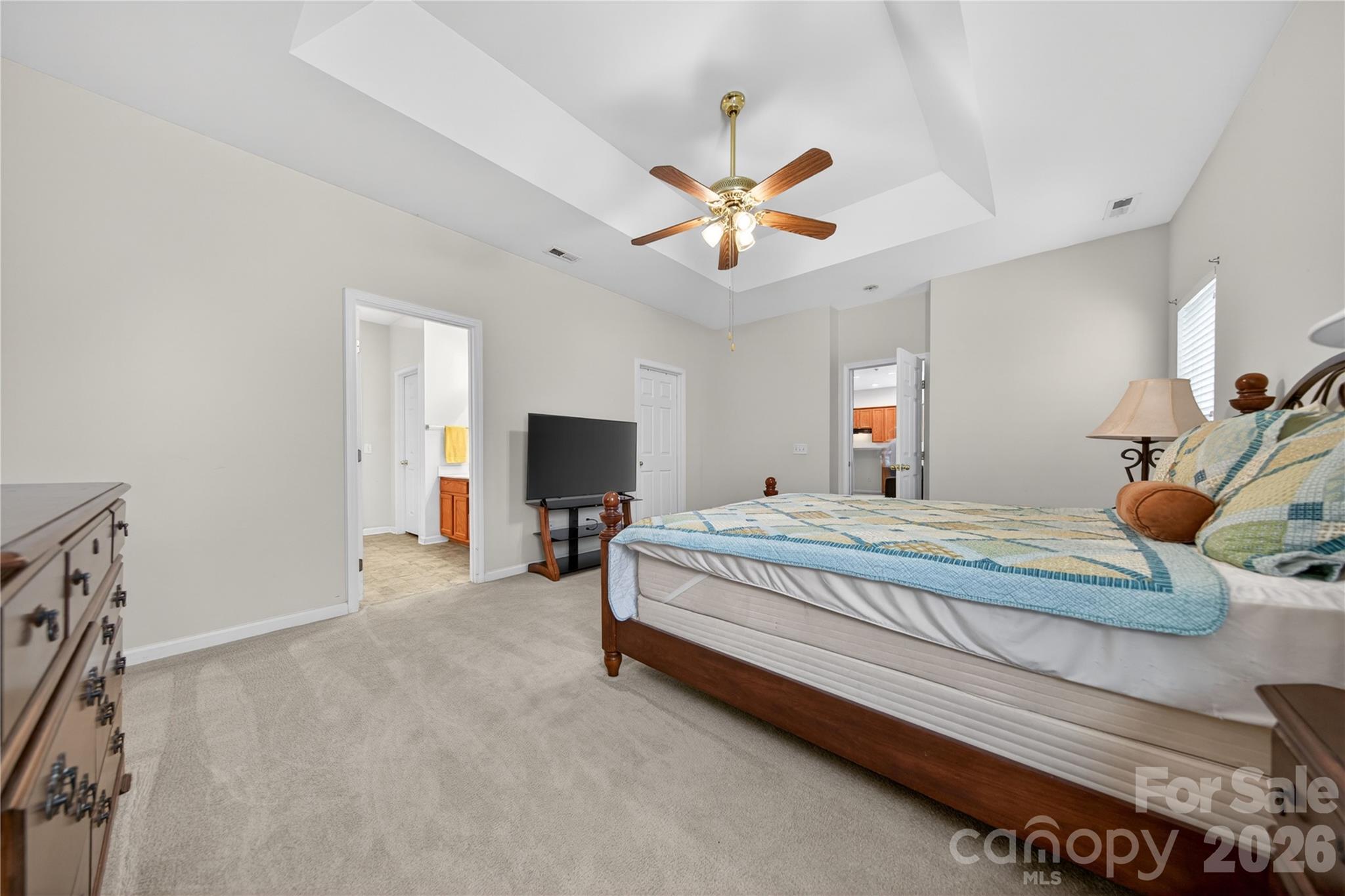 533 Fair Oaks Drive Fort Mill, SC 29708 - Photo 18 of 33 a bedroom with a bed and a chandelier