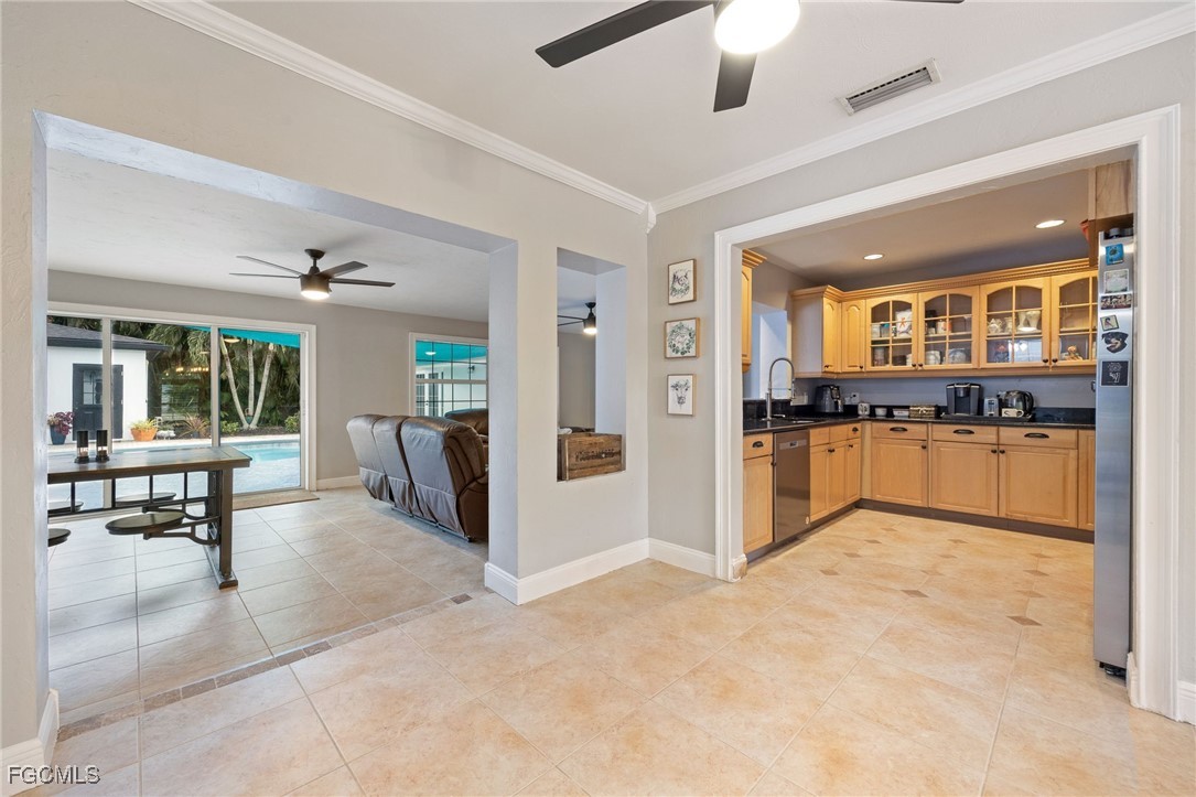 8327 Riviera Avenue Fort Myers, FL 33919 - Photo 15 of 49 a view of kitchen with refrigerator and cabinets