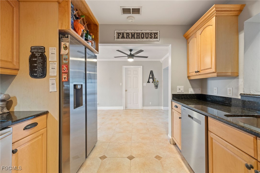 8327 Riviera Avenue Fort Myers, FL 33919 - Photo 18 of 49 a kitchen with stainless steel appliances granite countertop a refrigerator and a stove