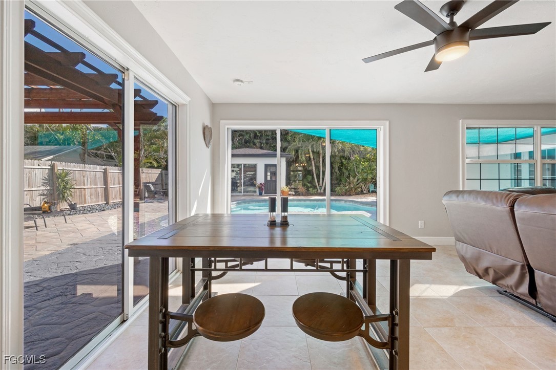 8327 Riviera Avenue Fort Myers, FL 33919 - Photo 19 of 49 a view of a dining room with furniture window and outside view