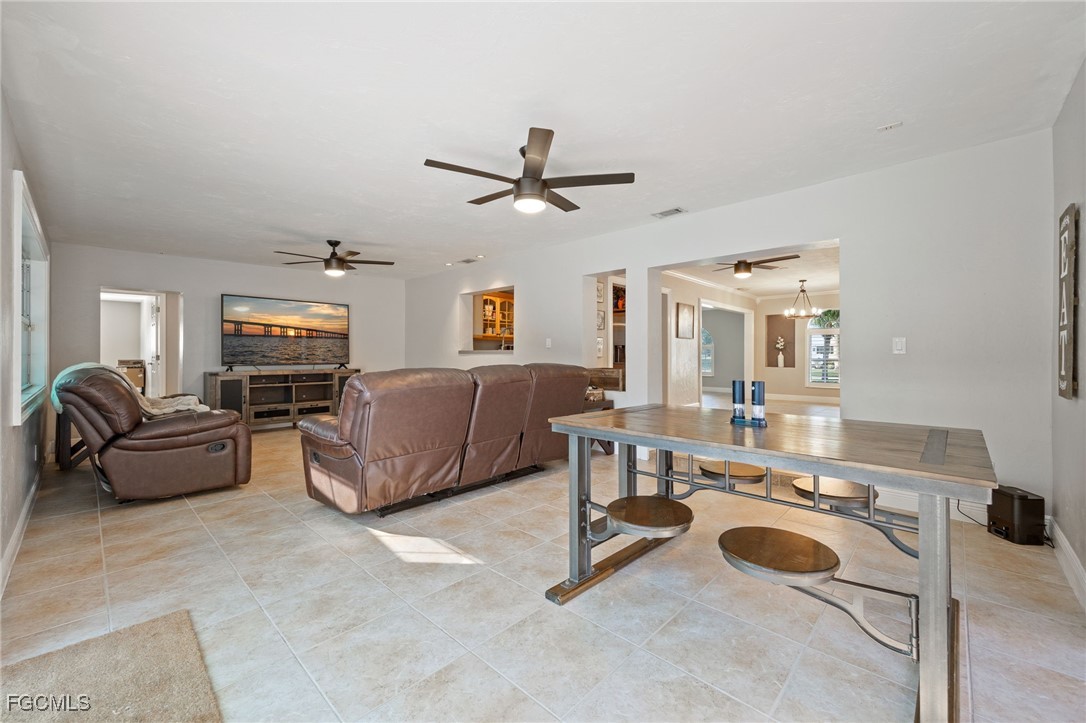 8327 Riviera Avenue Fort Myers, FL 33919 - Photo 20 of 49 a living room with furniture and a chandelier