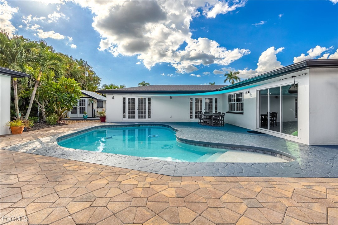 8327 Riviera Avenue Fort Myers, FL 33919 - Photo 2 of 49 a view of house with outdoor space and swimming pool