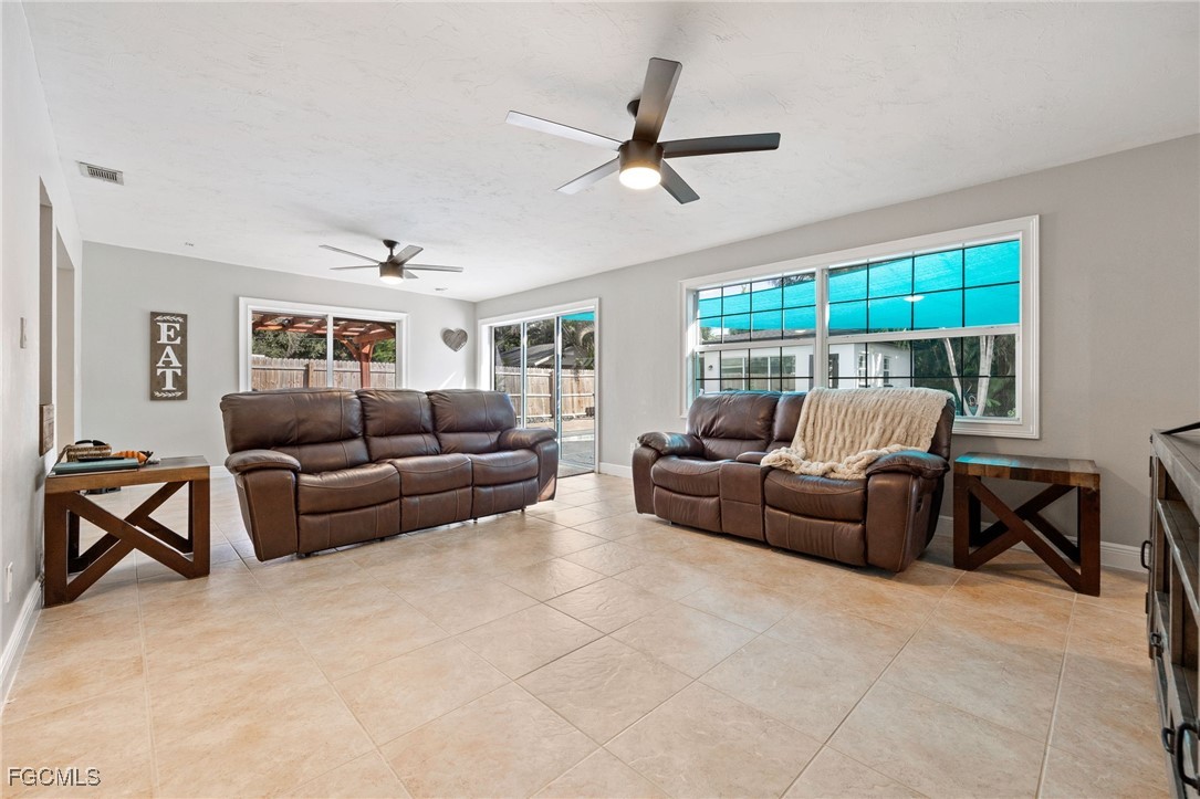 8327 Riviera Avenue Fort Myers, FL 33919 - Photo 23 of 49 a living room with furniture and a large window
