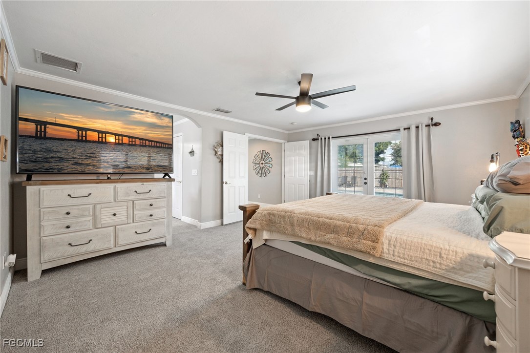 8327 Riviera Avenue Fort Myers, FL 33919 - Photo 27 of 49 a spacious bedroom with a large bed and a dresser