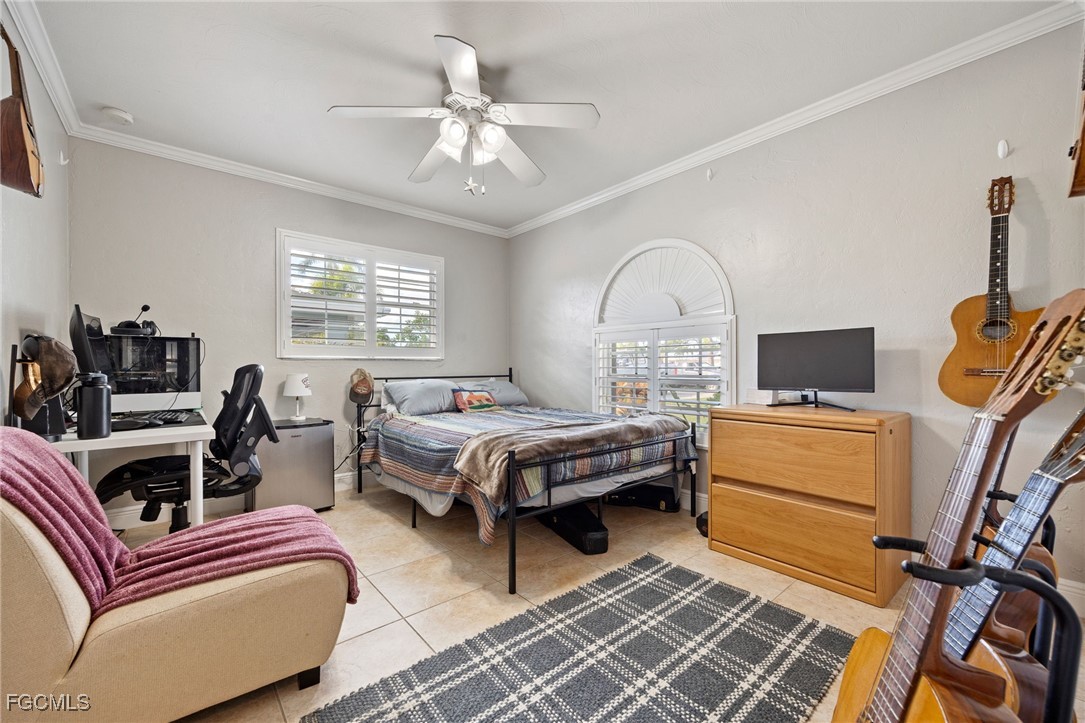 8327 Riviera Avenue Fort Myers, FL 33919 - Photo 32 of 49 a living room with furniture and a flat screen tv