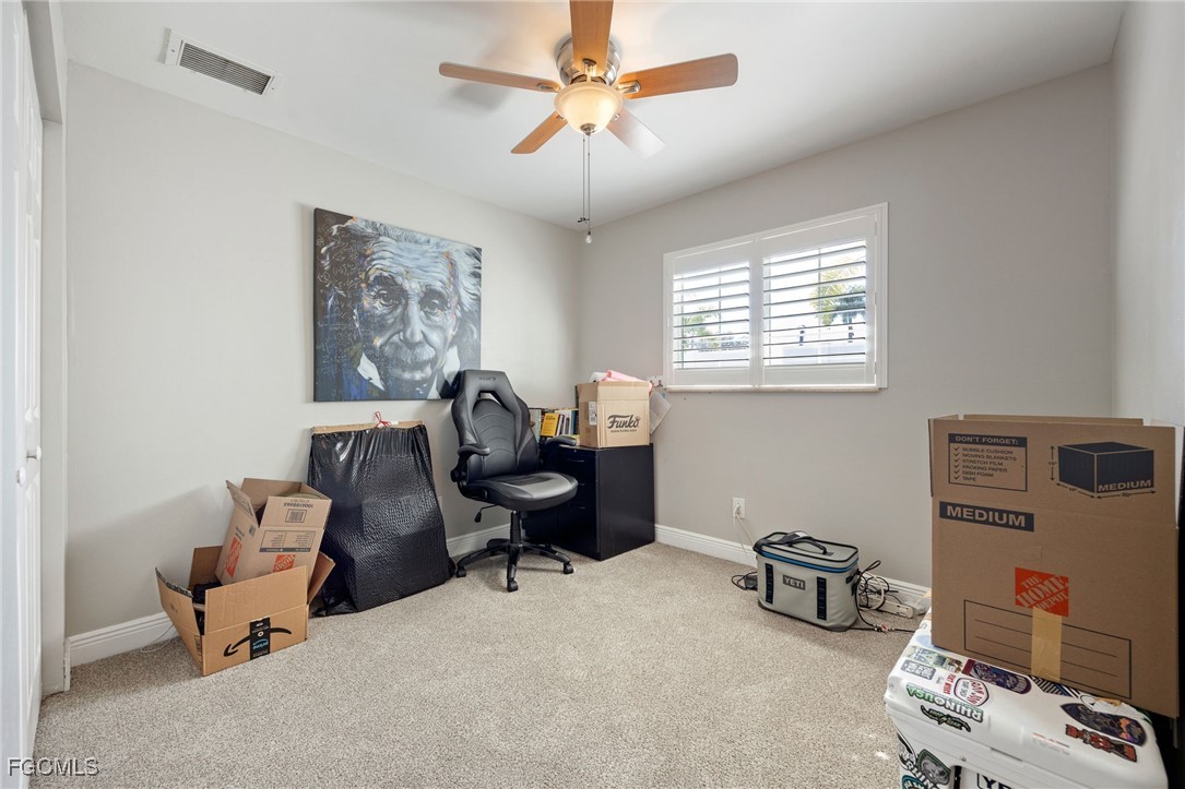 8327 Riviera Avenue Fort Myers, FL 33919 - Photo 38 of 49 a livingroom with workspace and a couch