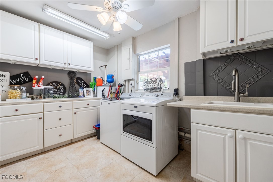 8327 Riviera Avenue Fort Myers, FL 33919 - Photo 39 of 49 a kitchen with white cabinets and white appliances