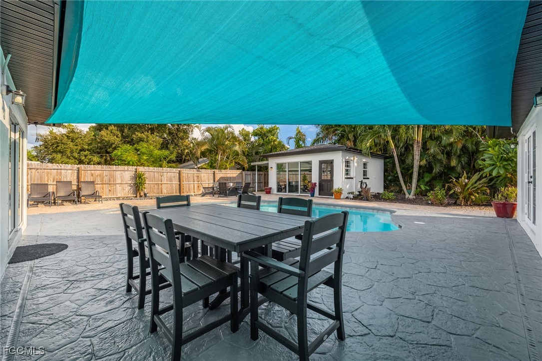 8327 Riviera Avenue Fort Myers, FL 33919 - Photo 42 of 49 a view of a dining table and chairs in patio