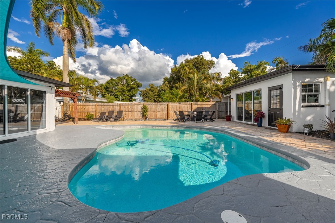 8327 Riviera Avenue Fort Myers, FL 33919 - Photo 43 of 49 a view of a swimming pool with a patio