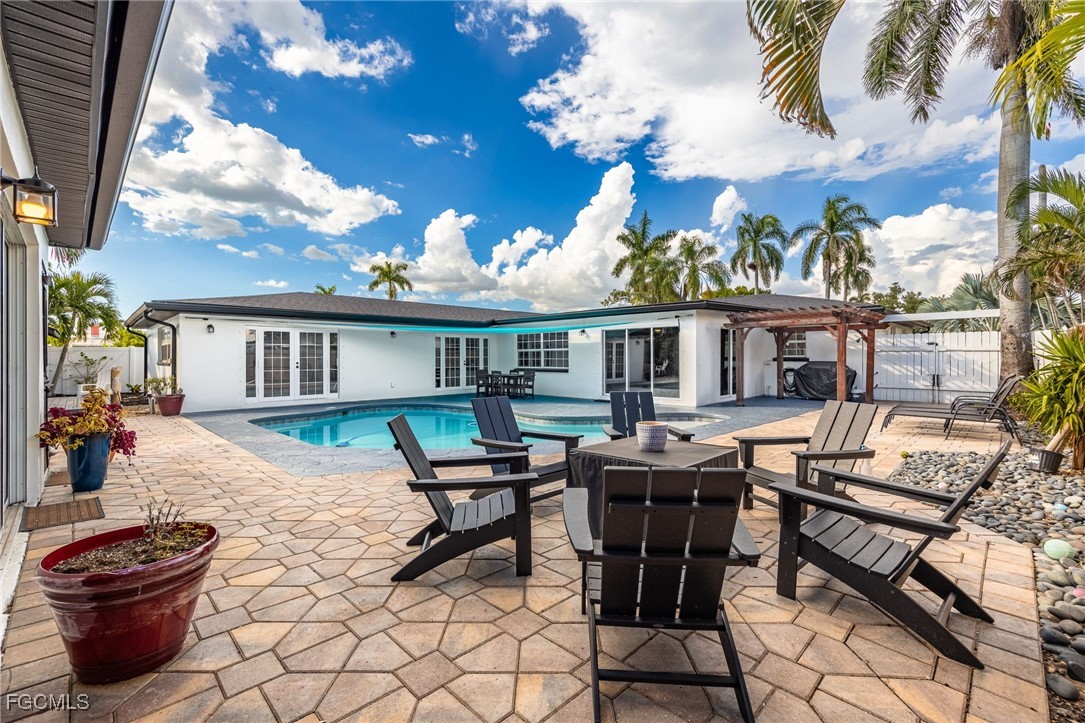 8327 Riviera Avenue Fort Myers, FL 33919 - Photo 47 of 49 a view of a house with backyard and sitting area