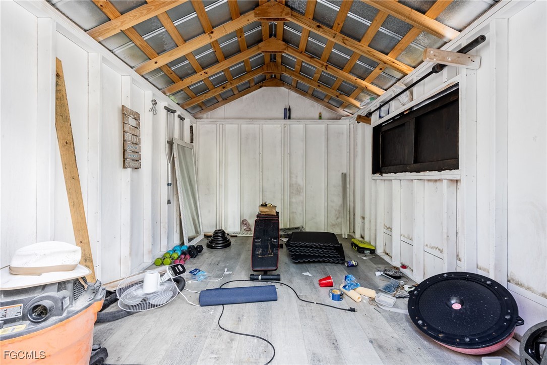 8327 Riviera Avenue Fort Myers, FL 33919 - Photo 49 of 49 a living room with furniture and a flat screen tv