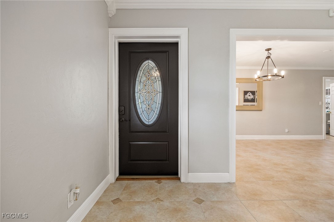 8327 Riviera Avenue Fort Myers, FL 33919 - Photo 8 of 49 a view of a hallway with wooden floor