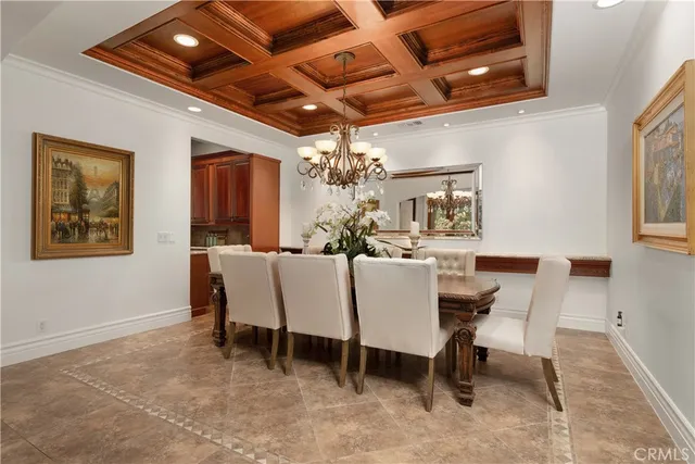 a living room with furniture a fireplace and a large window