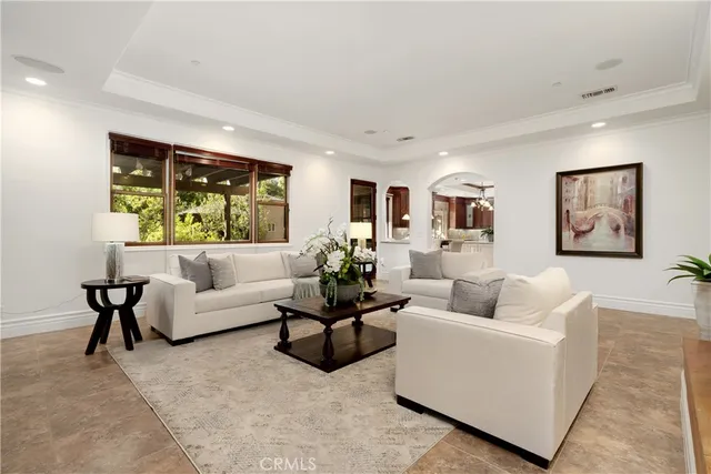 a view of a hallway with wooden floor and closet
