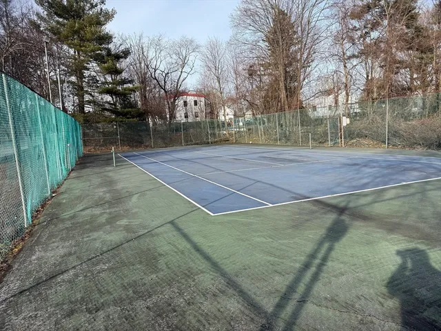 a view of outdoor space and tennis court