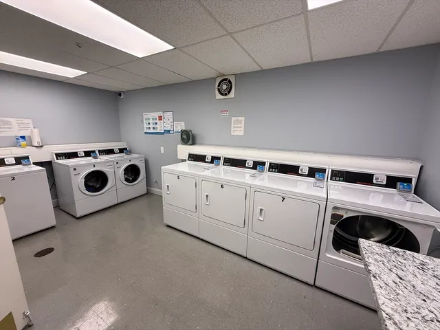a utility room with washer and dryer