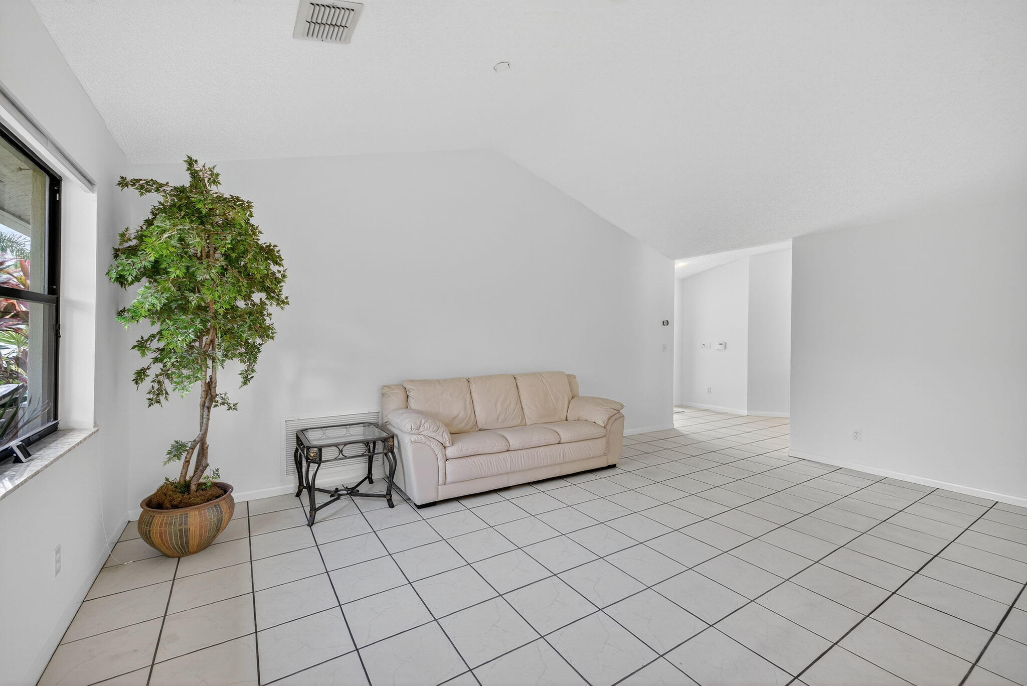 3140 Old Orchard Road Davie, FL 33328 - Photo 14 of 41 a living room with furniture and a potted plant