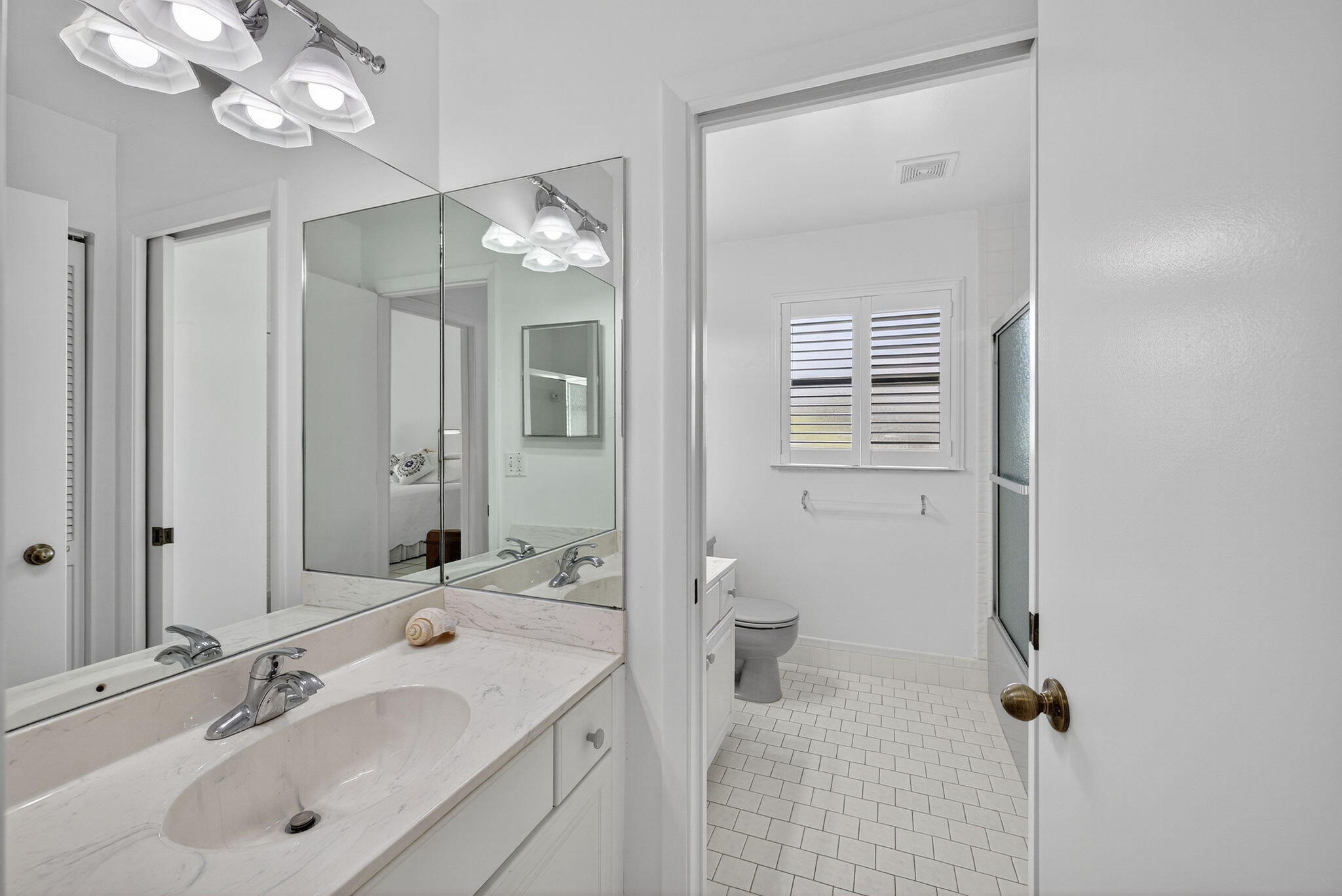 3140 Old Orchard Road Davie, FL 33328 - Photo 22 of 41 a bathroom with a sink a toilet a mirror and shower