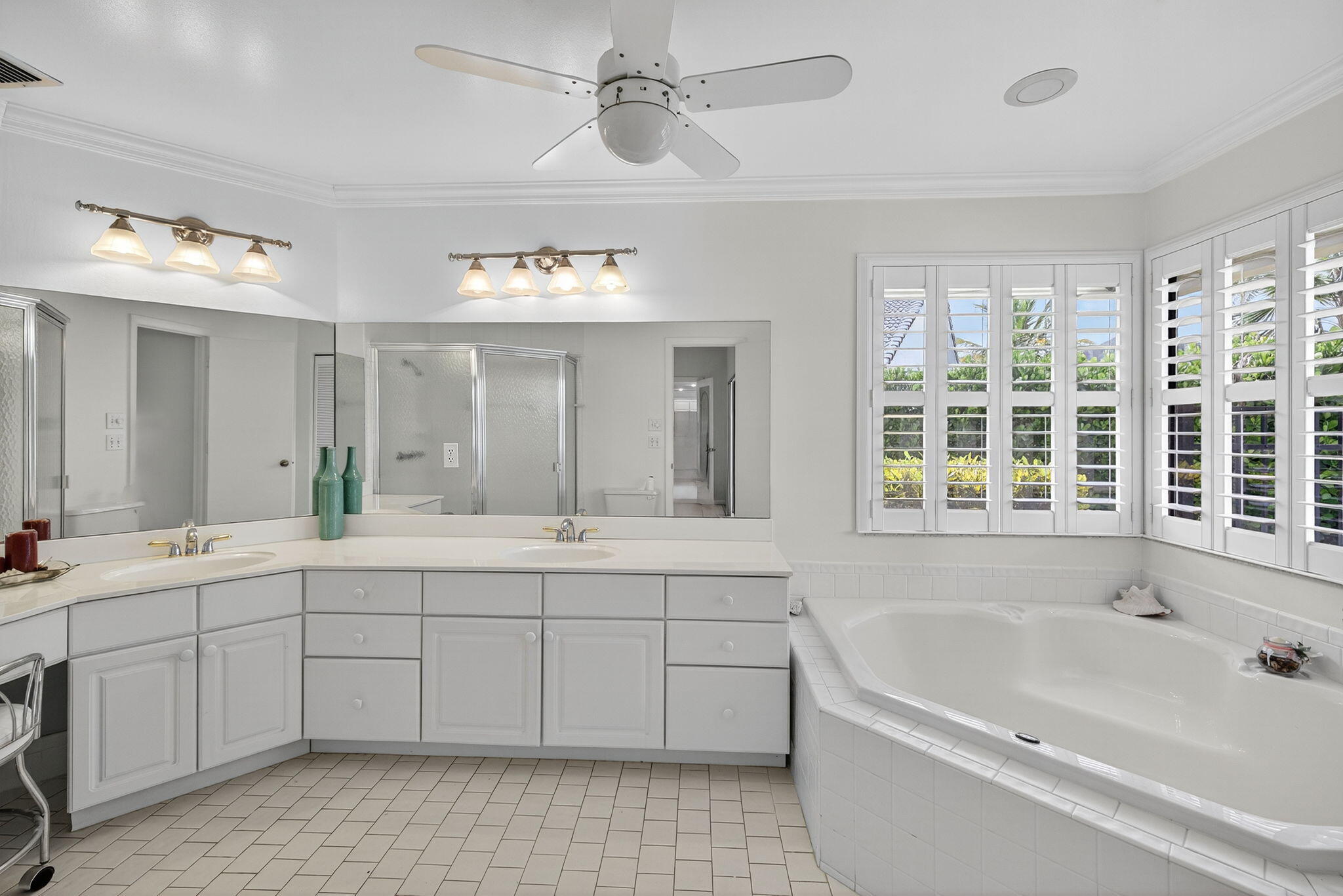 3140 Old Orchard Road Davie, FL 33328 - Photo 24 of 41 a spacious bathroom with a tub sink and mirror