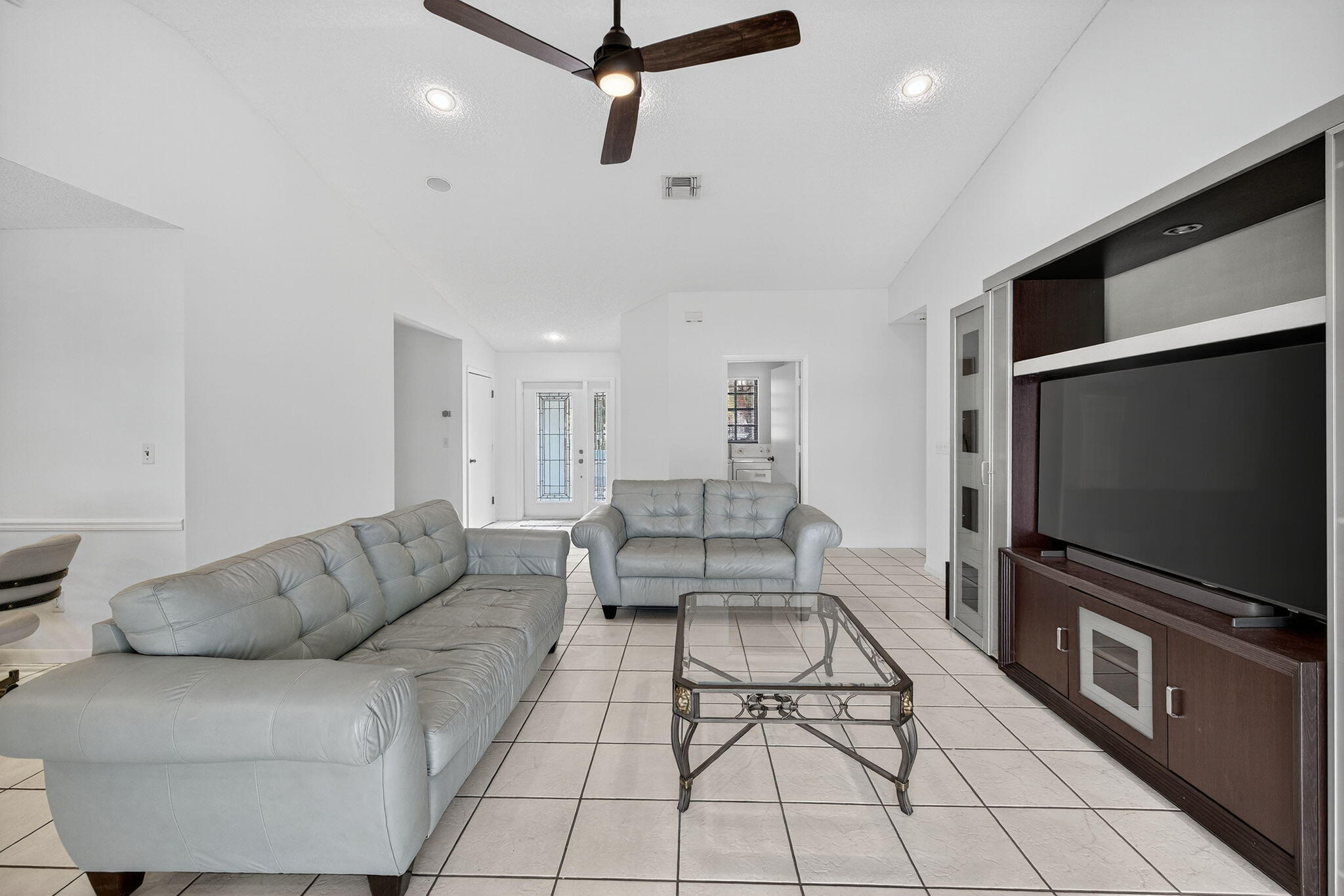 3140 Old Orchard Road Davie, FL 33328 - Photo 7 of 41 a living room with furniture and a flat screen tv