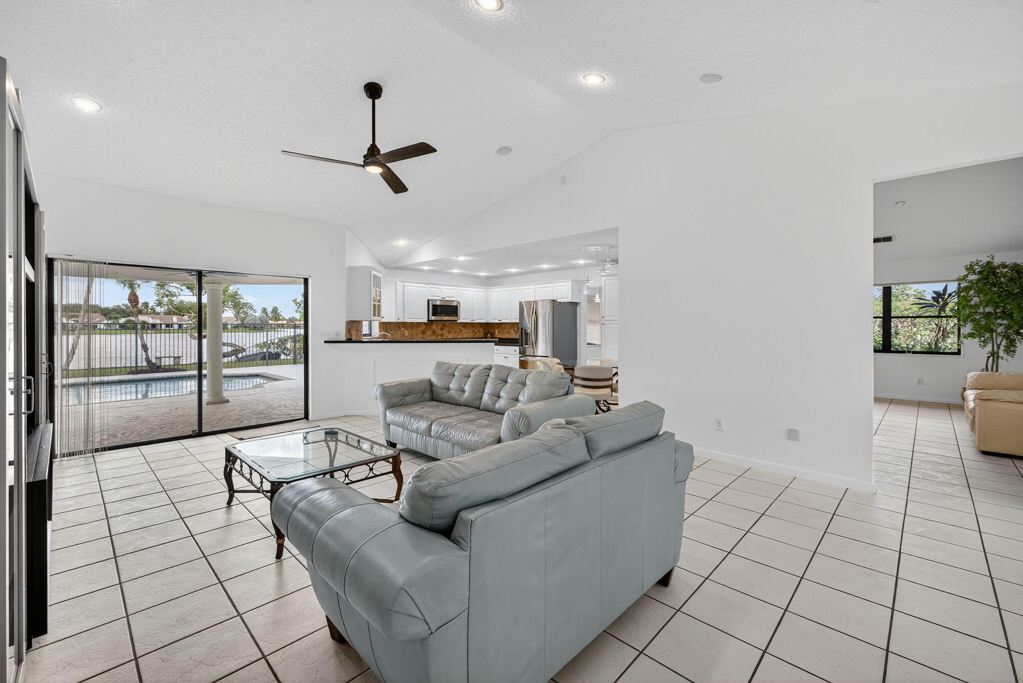 3140 Old Orchard Road Davie, FL 33328 - Photo 8 of 41 a living room with furniture and a ceiling fan