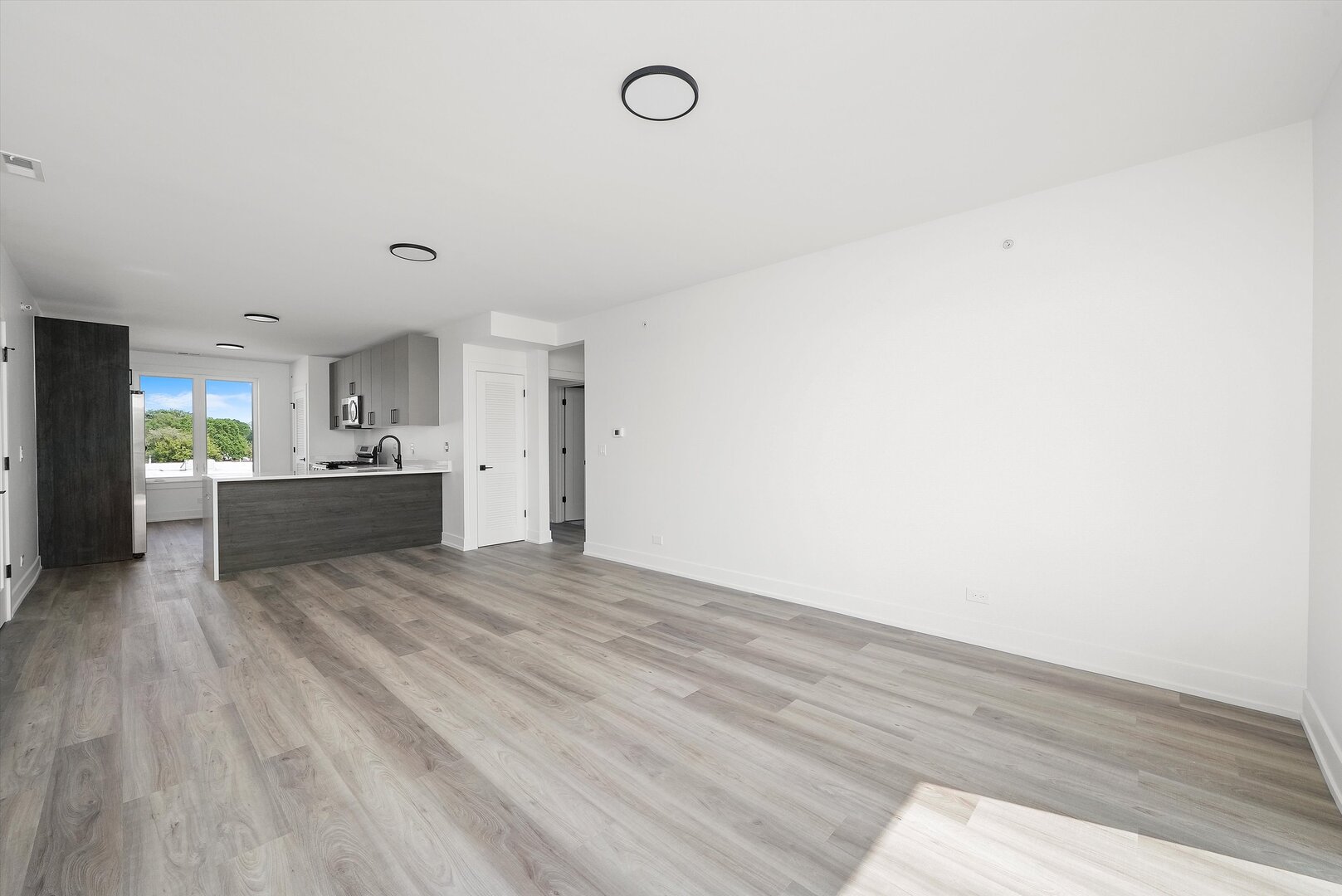 2030 Greenwood Street, Unit 206 Evanston, IL 60201 - Photo 12 of 27 a view of a kitchen with a sink and a stove top oven