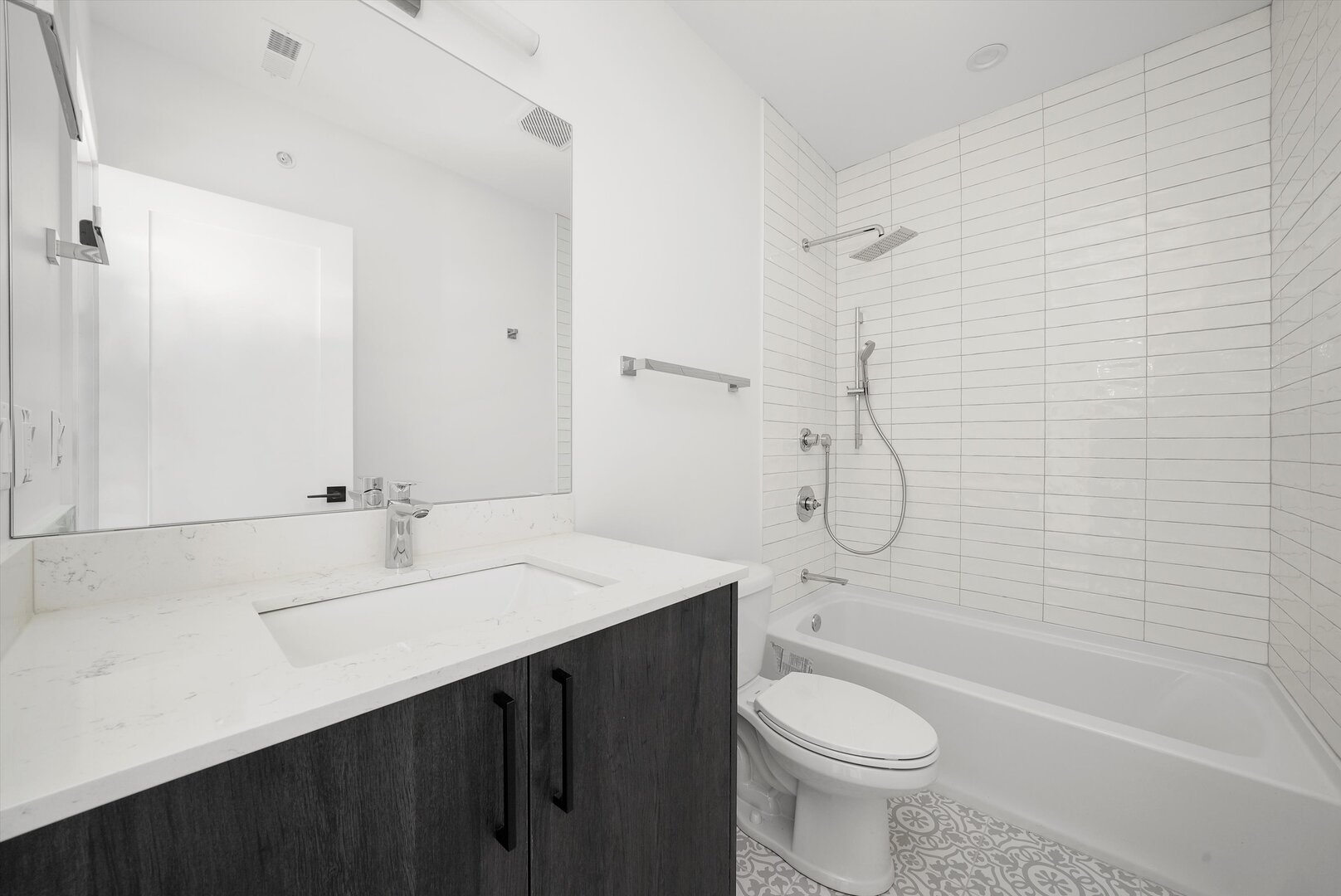 2030 Greenwood Street, Unit 206 Evanston, IL 60201 - Photo 20 of 27 a bathroom with a sink a toilet and shower