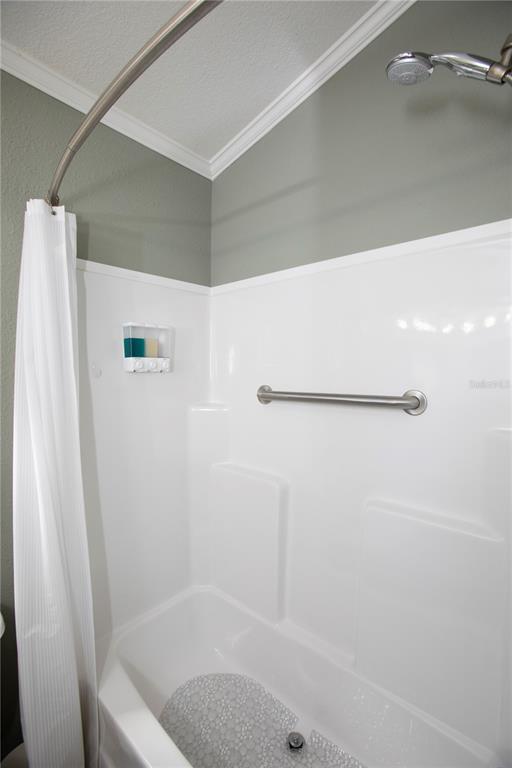 5642 Oak Ridge Avenue New Port Richey, FL 34652 - Photo 13 of 44 a bathroom with a bath tub