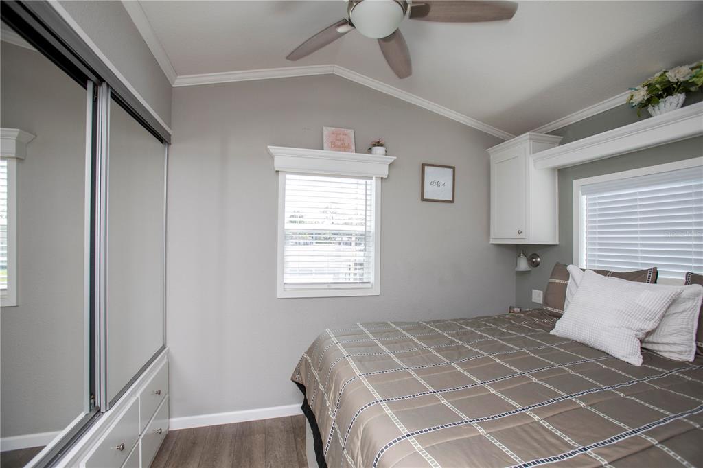 5642 Oak Ridge Avenue New Port Richey, FL 34652 - Photo 14 of 44 a bedroom with a bed and a window