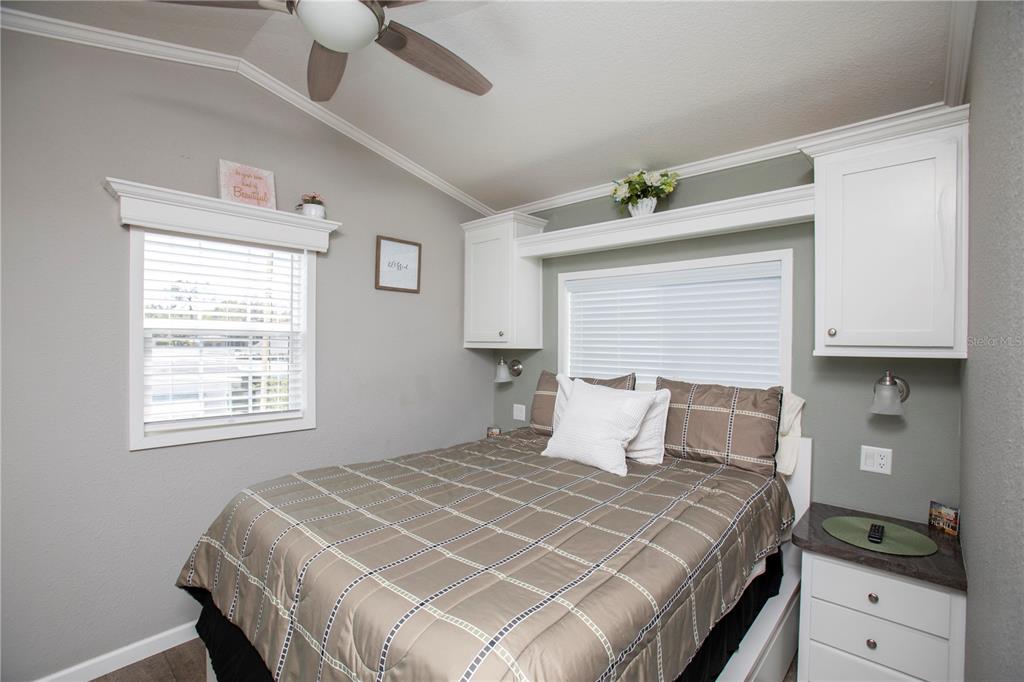 5642 Oak Ridge Avenue New Port Richey, FL 34652 - Photo 15 of 44 a bedroom with a bed and a window