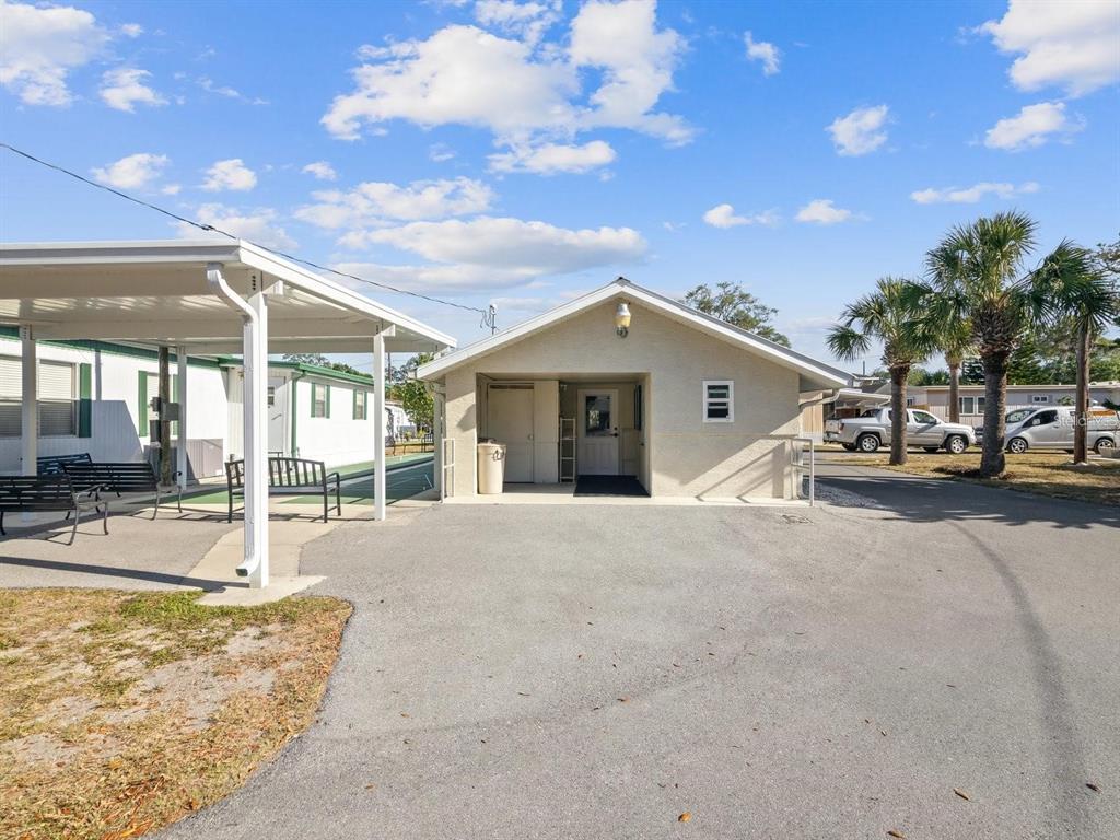 5642 Oak Ridge Avenue New Port Richey, FL 34652 - Photo 20 of 44 a view of a house with backyard and sitting area
