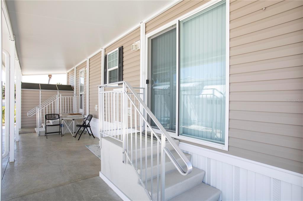 5642 Oak Ridge Avenue New Port Richey, FL 34652 - Photo 3 of 44 a view of staircase with open kitchen view