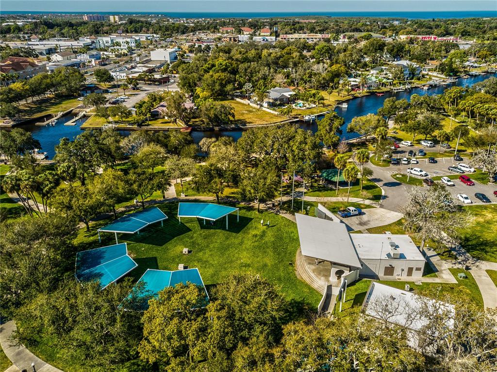 5642 Oak Ridge Avenue New Port Richey, FL 34652 - Photo 42 of 44 an aerial view of a house with a yard and lake view