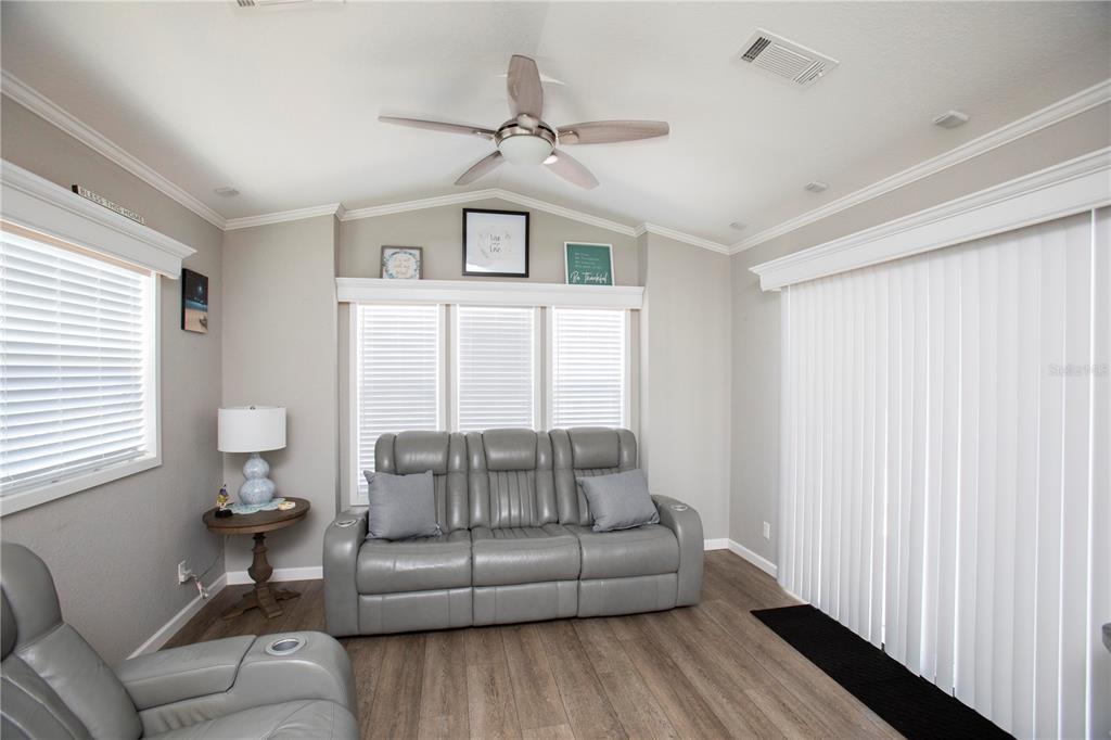 5642 Oak Ridge Avenue New Port Richey, FL 34652 - Photo 6 of 44 a living room with furniture and a window