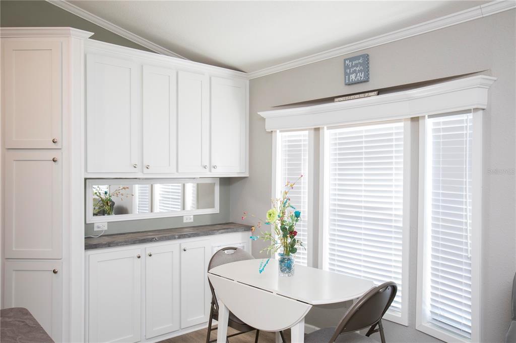 5642 Oak Ridge Avenue New Port Richey, FL 34652 - Photo 9 of 44 a view of a dining room with furniture and window