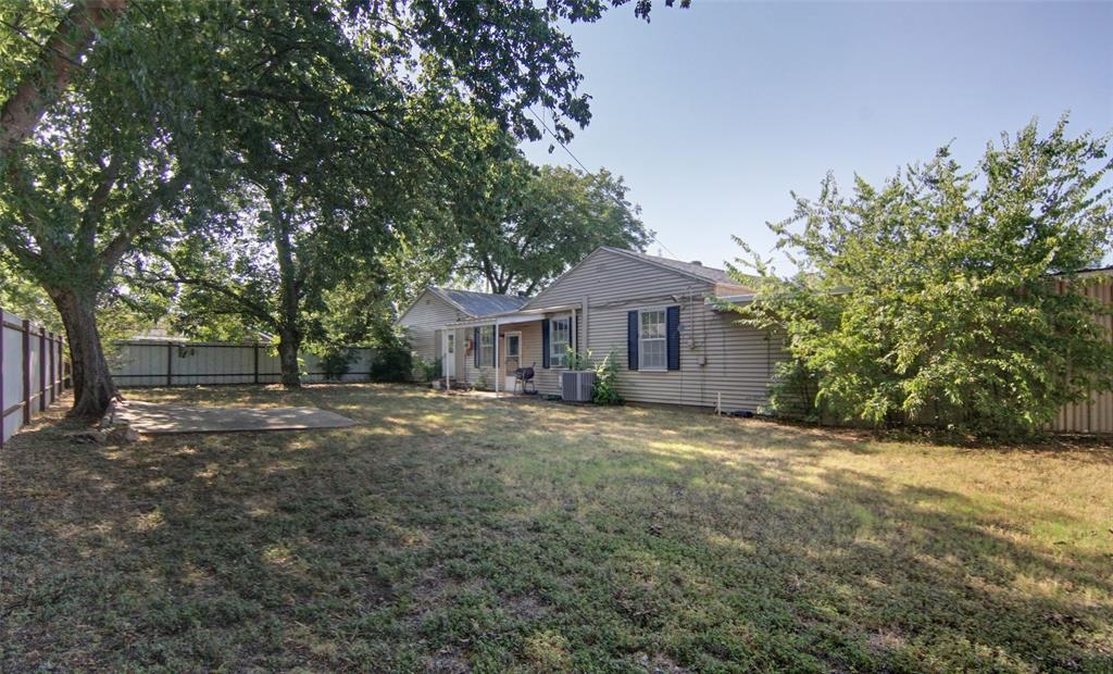730 Indiana Street Graham, TX 76450 - Photo 24 of 25 a front view of a house with a garden