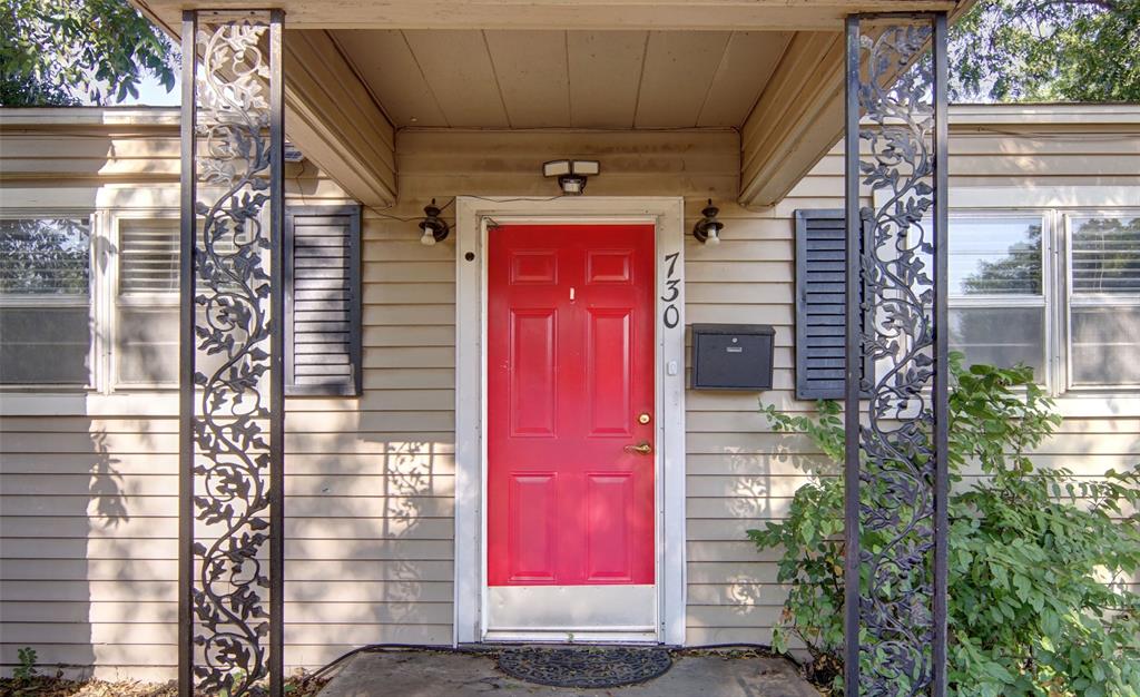 730 Indiana Street Graham, TX 76450 - Photo 5 of 25 a front view of a building with red door