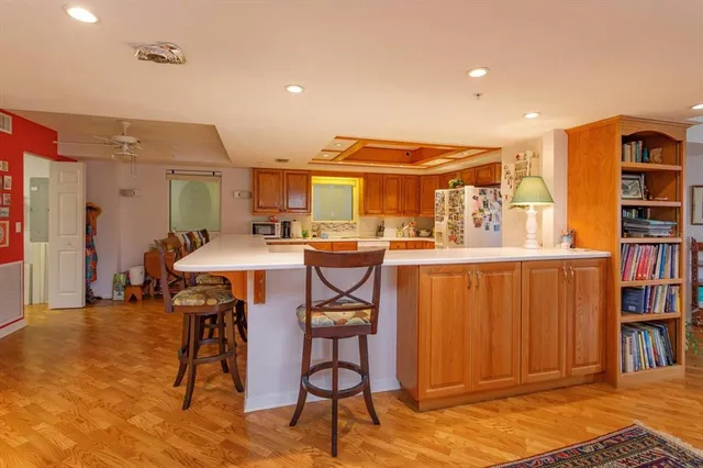a view of a dining room with furniture and a book shelf