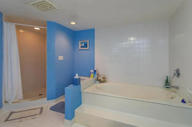 a bathroom with a bathtub and a sink