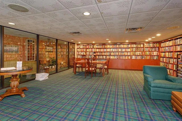 a lobby with furniture and wooden floor