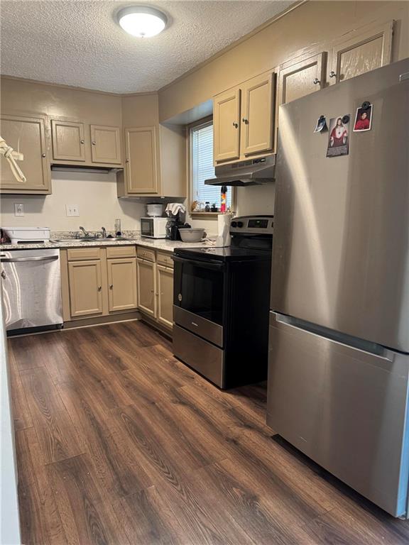 4701 Flat Shoals Road, Unit 41G Union City, GA 30291 - Photo 4 of 15 a kitchen with granite countertop a refrigerator stove top oven and cabinets