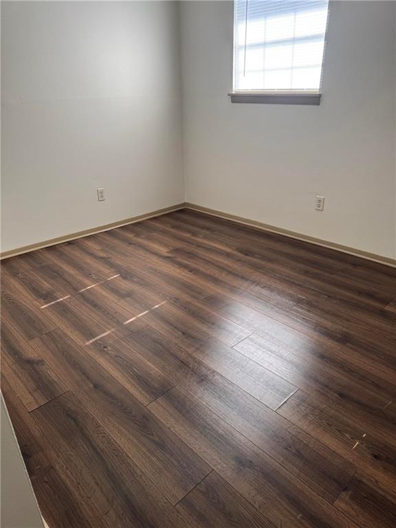 4701 Flat Shoals Road, Unit 41G Union City, GA 30291 - Photo 9 of 15 an empty room with wooden floor and windows