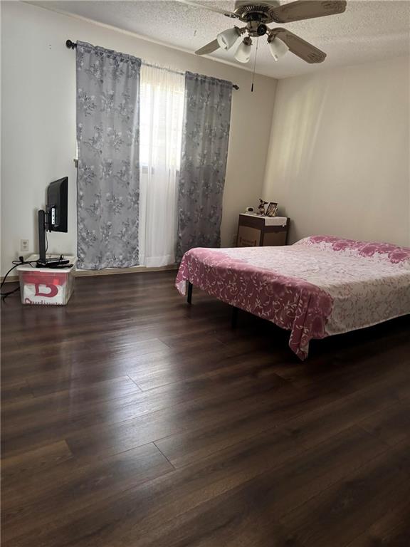 4701 Flat Shoals Road, Unit 41G Union City, GA 30291 - Photo 10 of 15 a bedroom with a bed and a ceiling fan