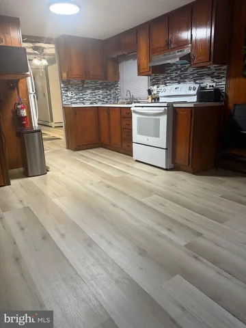 a close view of stove and microwave