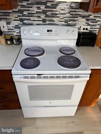 a close view of stove and microwave